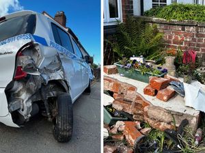 Supporting image for story: Car rolls over after hitting parked vehicle - shunting it into garden wall and gas pipe