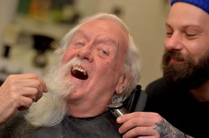 Peter Love at Risdons Barbers, with barber Mat Glover, during the shave