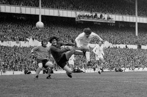 lan Mullery of Spurs flies in with a header with Wolves goalkeeper Phil Parkes in the UEFA Cup final of 1972