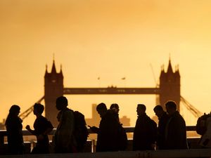 People walking in silhouette in London