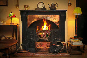 Relax in front of a roaring fire in a cosy lounge at The Pheasant
