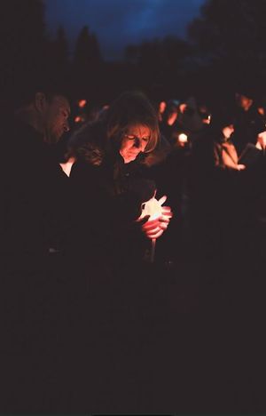 Hospice nurses lit candles for members of the audience to hold to create a beautiful backdrop against the night sky