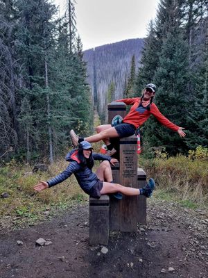 Kate and Nicola celebrating at the Northern Terminus of the Pacific Crest Trail – the Canadian border