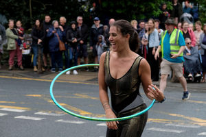 A circus performer showed off her hula skills as she took part in the parade.