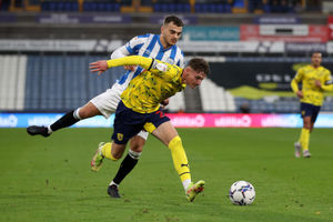 Daniel Sinani of Huddersfield Town and Taylor Gardner-Hickman of West Bromwich Albion. (Photo by Adam Fradgley/West Bromwich Albion FC via Getty Images).