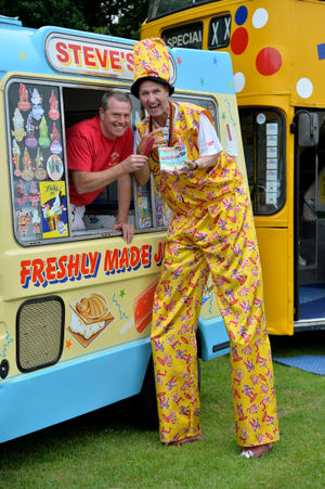 Mad Dominic picks up an ice cream from Steve's soft scoop at Halesowen Carnival