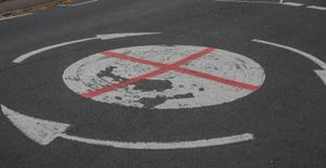 A roundabout on the junction of Chinn Brook Road and Yardley Wood Road which has been painted with a St George's Flag.