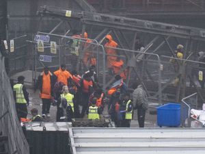 A group of people thought to be migrants are brought in to Dover following a small boat incident in the Channel