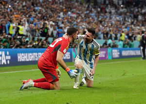 Argentina's Lionel Messi celebrates his sides victory in the penalty shoot out with goalkeeper Emiliano Martinez