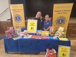 President Debra Coburn with Lion Elaine Morgan at a toy collecting event. 