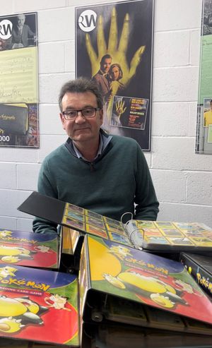 Auctioneer Richard Winterton with the Pokémon collection.