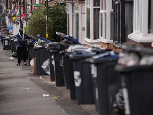 Rows of overflowing bins