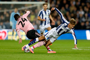 Isaac Price goes into a tackle for Albion (Photo by Adam Fradgley/West Bromwich Albion FC via Getty Images)