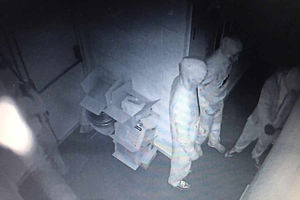 Three suspects are captured on camera in the building