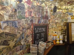 The bar is also covered in notes from around the world