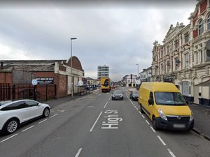 Supporting image for story: Two people injured as car rolls onto its side in two-vehicle crash