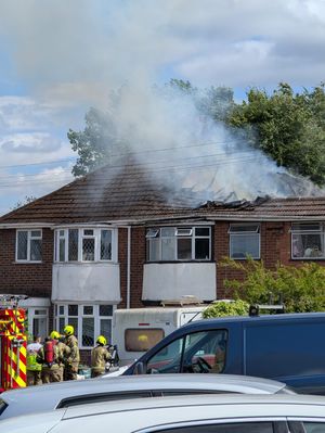 The fire caught hold quickly, with smoke clearly visible coming through the roof