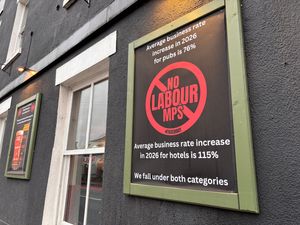 Sign protesting over proposed rises to business rates outside The Alb in Shrewsbury