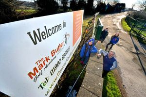 The team at the entrance to the site