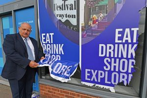 Market Drayton mayor Tim Manton with the banners that have been vandalised and peeled off. 