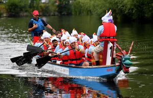 A bunch of mad hatters bomb down the River Severn at the Severn Hospice Dragon Boat Festival
