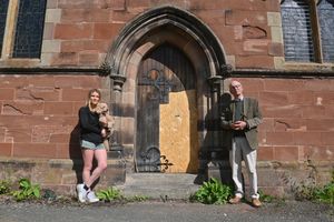 St Marys Church, Market Drayton and pictured is auctioneer: Nick Allsopp and from The Crown pub: Nicky Marshall and Teddy. There will be a fundraising auction after the church door was damaged by fire. The church already has a fundraising drive for its organ going on and has also had a wall collapse to contend with too.