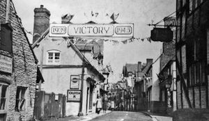 A 'Victory' banner was stretched across Much Wenlock High Street as the town celebrated Victory in Europe. According to Ina Taylor, author of the 2011 book Much Wenlock Past To Present, Holy Trinity Church and the guildhall were floodlit; sports and tea parties were held along with a thanksgiving service, and at night an effigy of Hitler was burned.