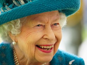 Supporting image for story: Queen pictured working in new image released for 70-year milestone