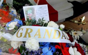 Flowers adorned Bill Archer's coffin