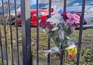 Flowers sit at the scene of a fatal stabbing outside of a mosque in Smethwick