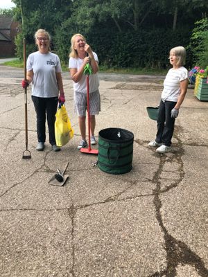 Louise Longman, Beverley Stokes and Audrey Greatbatch sweeping The Horsewash.