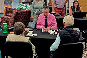 Alexander Clement valuing watches.