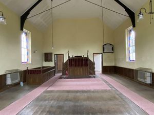 The listing notes the pew and organ are not included in the sale. Photo: Halls