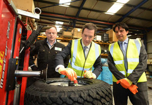 Greasing the wheels of industry - George Osborne with technician Alex Chandler and James Morris