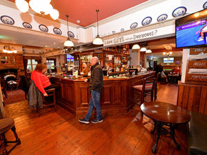 Supporting image for story: The vibrant pub that's grown from a small home brew and run by a woman enjoying a new career