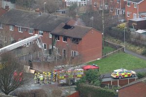 Damage to the house can be seen in the aftermath of the fire