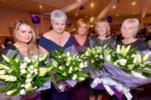 Suzy Evans presents flowers to Chloe Albrighton, Cheryl Stollery, Julie Grubb and Joyce Hibbs, who all lost loved ones