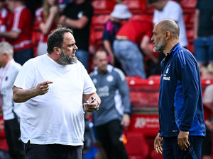 Nottingham Forest's Portuguese manager Nuno Espirito Santo (R) speaks with Nottingham Forest's Greek co-owner Evangelos Marinakis (Photo by JUSTIN TALLIS/AFP via Getty Images)          