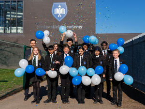 Headteacher Joe Phillips and pupils at Wednesfield Academy celebrating the Ofsted inspection result