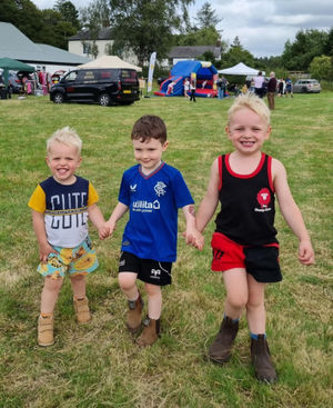 Henry and Charlie Goodwin, with their friend Albie Williams, enjoying the show
