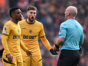 Matt Doherty and Nelson Semedo protest to referee Simon Hooper (Photo by Stu Forster/Getty Images)