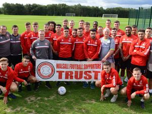 Supporting image for story: Walsall players make donation to supporters trust