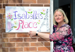 Jen Dalton unveils the Isabella's Place sign.