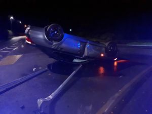 Supporting image for story: Car crashes onto its roof on wet road in Shrewsbury