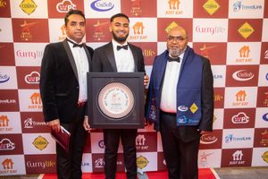 Rafique Miah (Right) with staff from Wombourne Tandoori at the awards ceremony