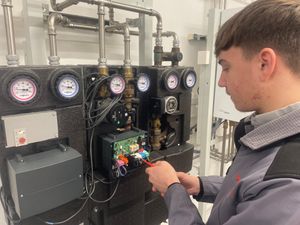 Supporting image for story: Teenage engineer apprentice learning quickly on the job