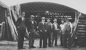 Sam Spencer, far right, with son Charlie alongside, at his timber yard in Craven Arms. Picture: Dave Mulliner. 