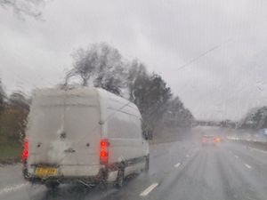 Supporting image for story: Six points and fine for white van man using phone in torrential rain