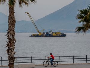 A crane on the water where a superyacht sank