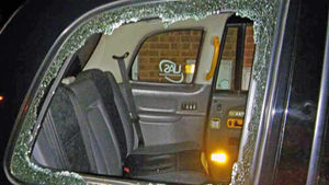 The taxi window was completely smashed by the brick